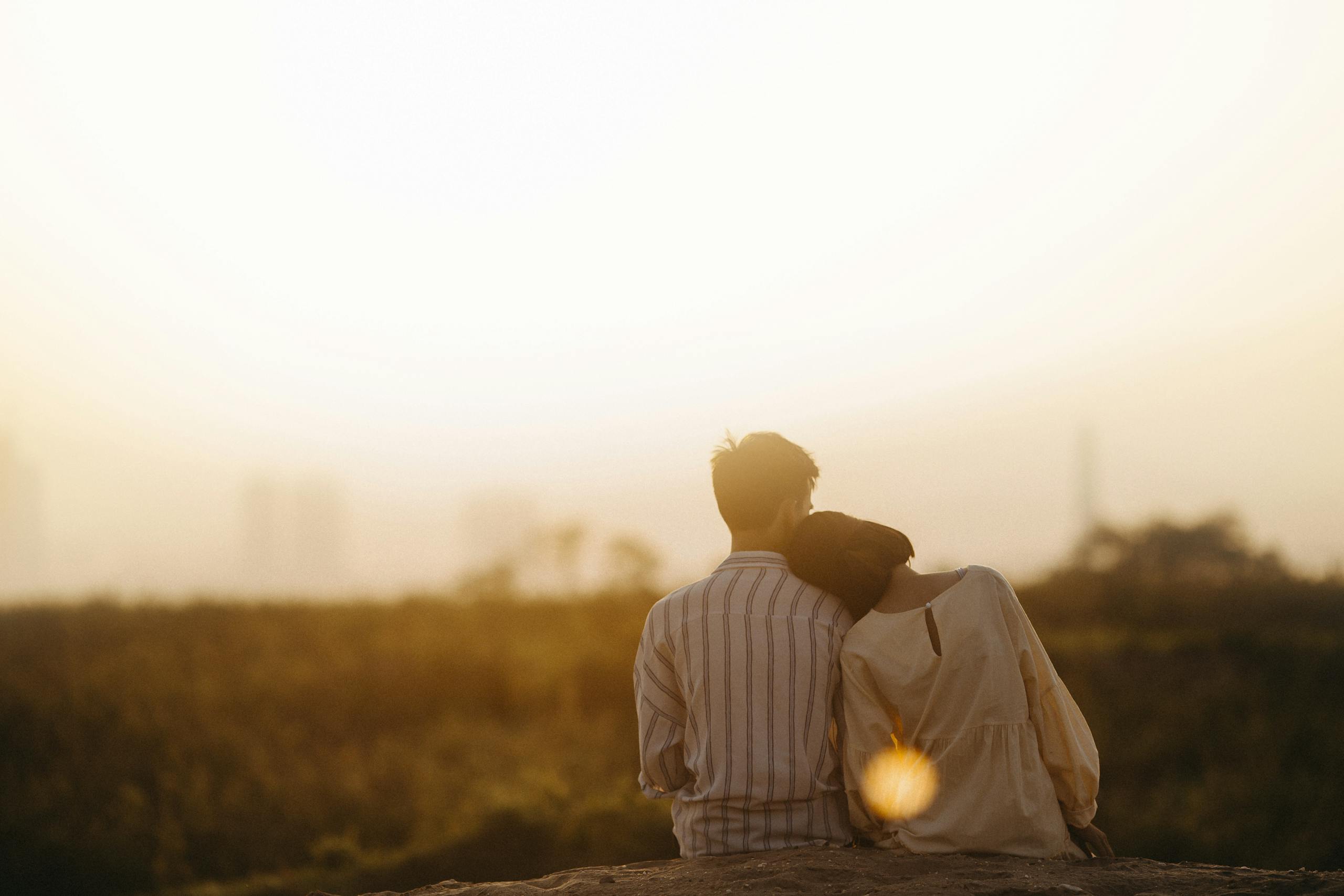 A couple enjoys a serene moment together during a sunset in Gia Lai, Vietnam.