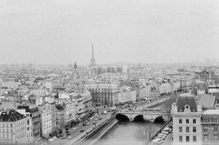 Stunning black and white aerial view of Paris showcasing the Eiffel Tower and historic architecture.